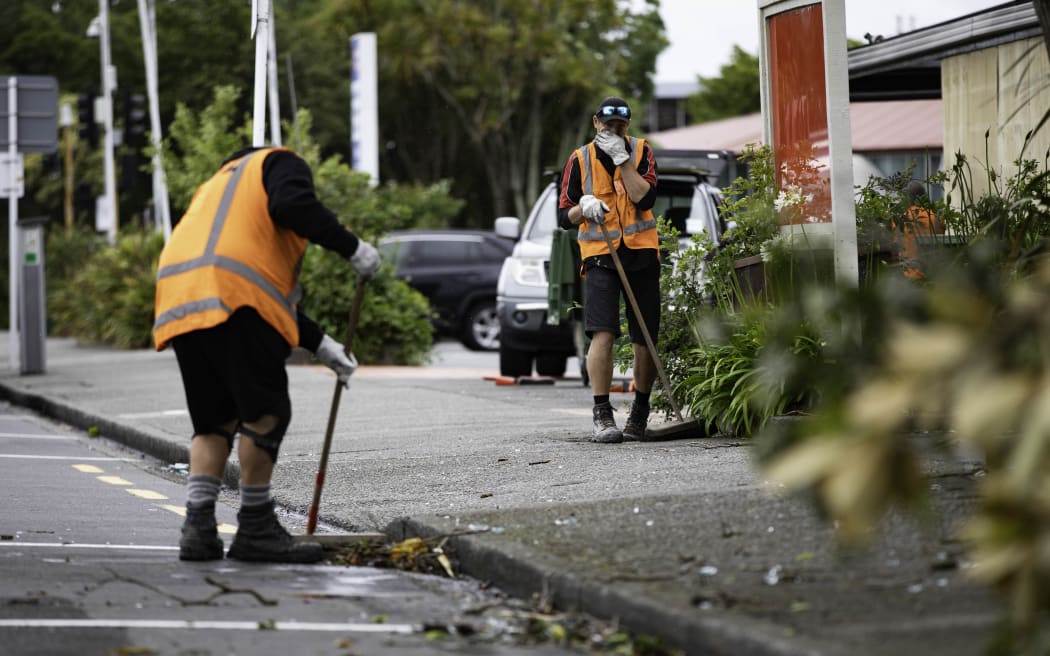 Crews clean up the roads after a severe thunderstorm ripped across Lower Hutt, on 12 December, 2023.