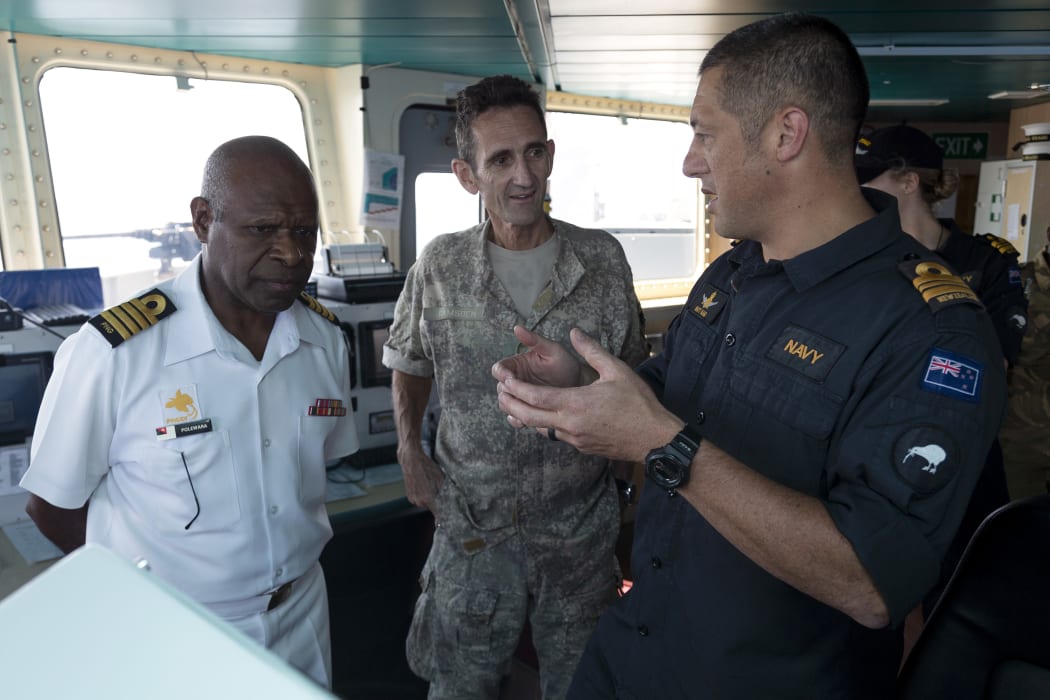 Matt Kaio (right), the New Zealand Maritime Security Operations Officer for APEC 2018, briefs Captain Phillip Polewara, the Chief of Staff of the Papua New Guinea Defence Force, and New Zealand Defence Force officer Colonel Jeremy Ramsden.