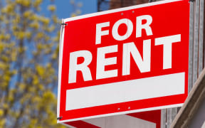 A 'for rent' sign.