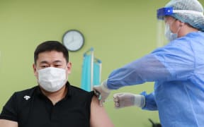 Mongolian Prime Minister Oyun-Erdene Luvsannamsrai receives his first dose of the AstraZeneca/Oxford Covid-19 vaccine at a hospital in Ulaanbaatar, the capital of Mongolia on February 23, 2021.