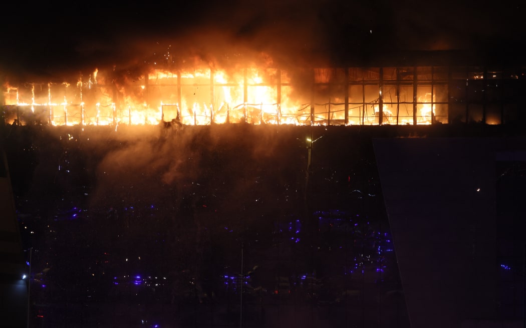 A view shows the burning Crocus City Hall concert hall following the shooting incident in Krasnogorsk, outside Moscow, on March 22, 2024.