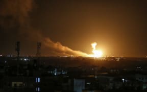 A ball of fire is seen following an Israel airstrike at Rafah in the southern Gaza Strip early on February 23, 2020.