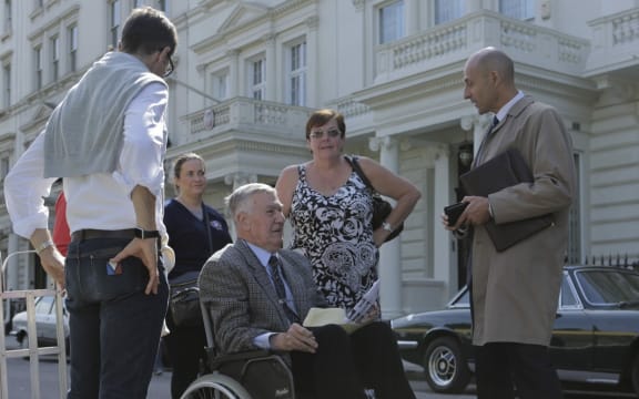 Max Vernon (wheelchair) talks to actor Mark Strong on the set of 6 Days.
