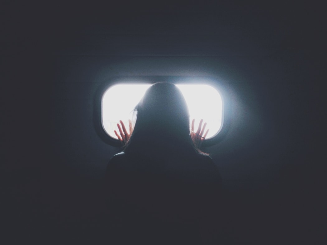 hand behind window