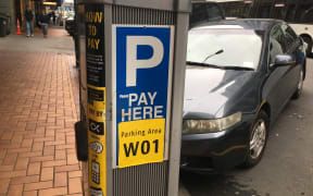 A file photo of someone paying for parking in Wellington's CBD