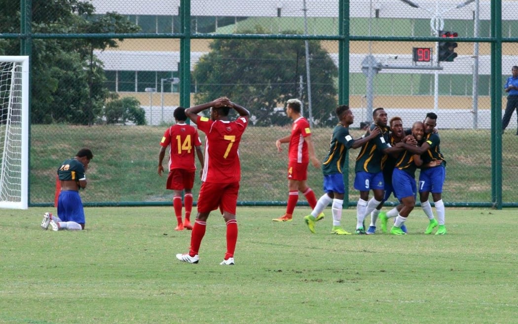 Raymond Gunemba (7) puts his hands on his head as Solomon Islands skipper  Henry Fa'arodo equalises from the penalty spot in the first half.
