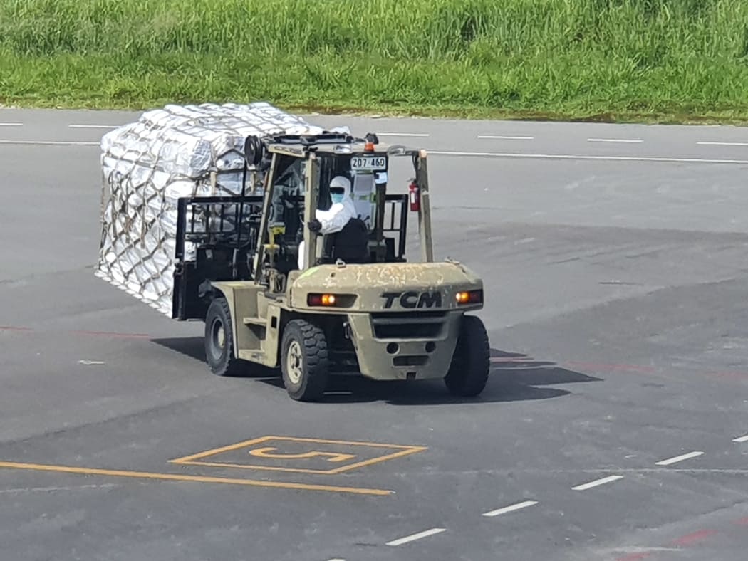Medical and humanitarian aid sent by Australia's Air Force to Vanuatu being offloaded at Bauerfield Airport.