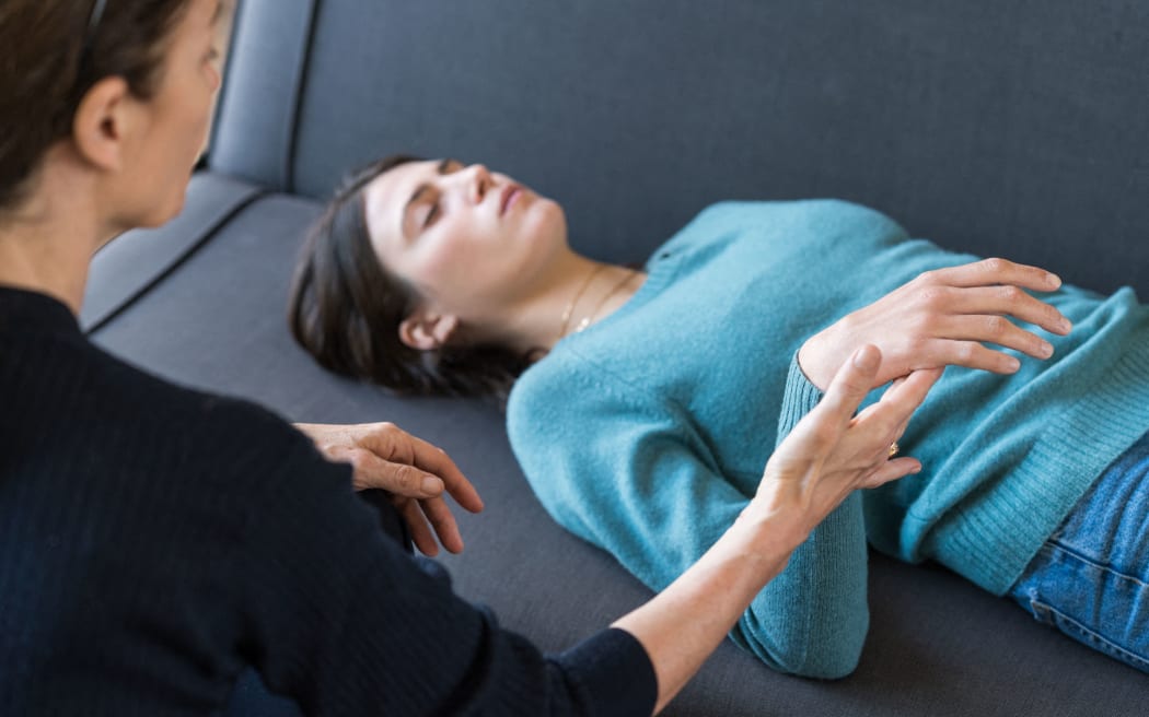 Young woman undergoing ericksonian hypnosis. 
Paris, France 

VOISIN/PHANIE (Photo by VOISIN / Phanie / Phanie via AFP)