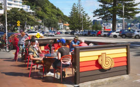 Diners at Beach Babylon cafe on Wellington's Oriental Parade.