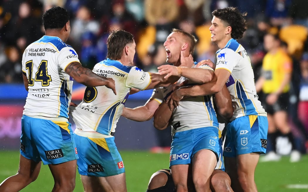 Titans players celebrate winning the game in golden point time from a drop goal by Tanah Boyd during the Vodafone Warriors v Gold Coast Titans.