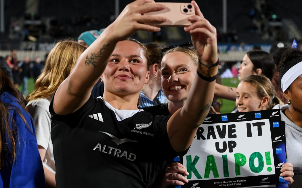 Kaipo Olsen-Baker of the Black Ferns with fans.