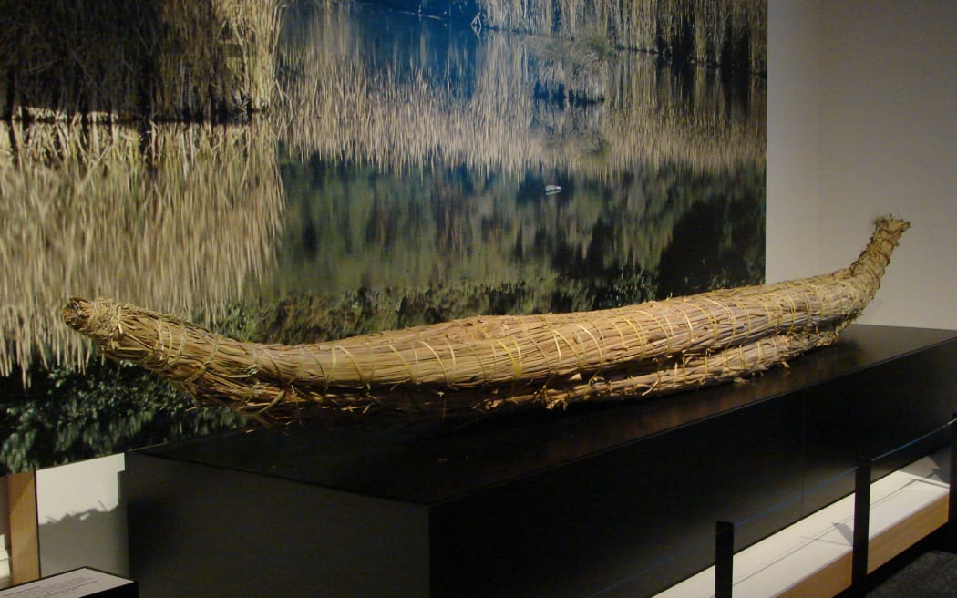 A model of a mōkihi, or reed waka, on display at Toitū Otago Settlers Museum.