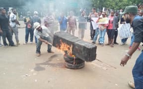 Student protesters burning a coffin in Jakarta on 18 January, 2019.