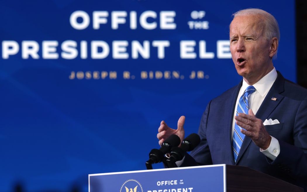 US President-elect Joe Biden lays out his plan for combating the coronavirus and jump-starting the nation's economy at the Queen theater January 14, 2021 in Wilmington, Delaware.