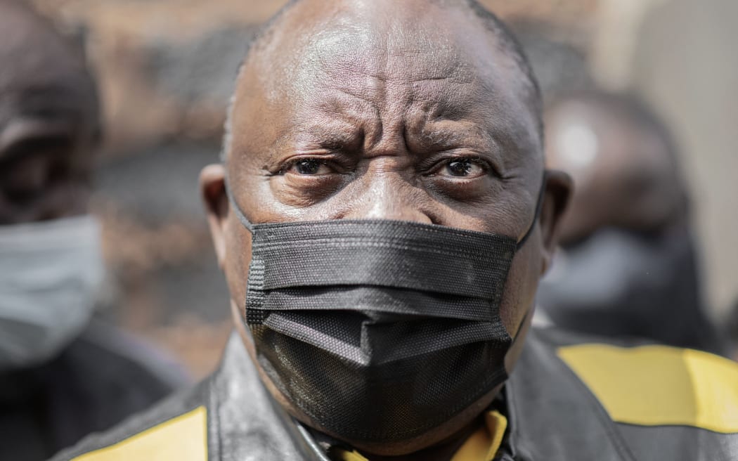 South Africa and Africa National Congress (ANC) president, Cyril Ramaphosa meets a crowd of supporters during a visit at Nomzamo informal settlement in Soweto, on September 18, 2021.