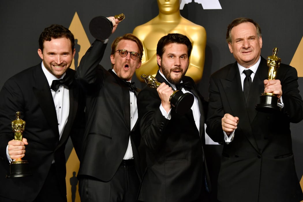 (L-R) Visual effects artists Dan Lemmon, Andrew R. Jones, Adam Valdez and Robert Legato, winners of Best Visual Effects for 'The Jungle Book' pose in the press room during the 89th Annual Academy Awards at Hollywood & Highland Center on 26 February 2017 in Hollywood, California.