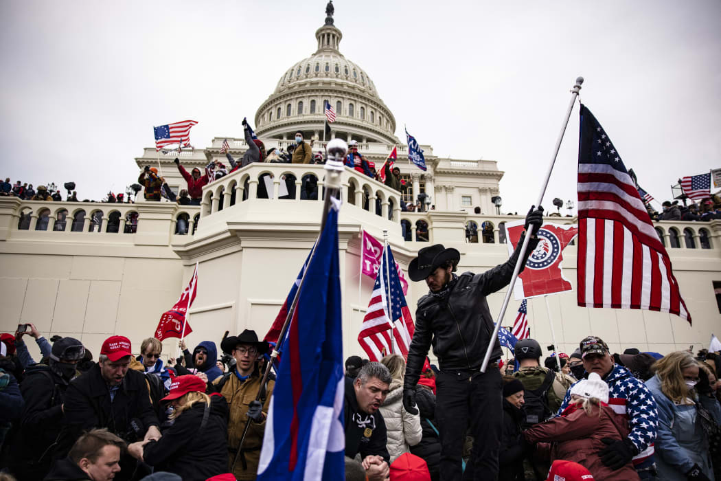 WASHINGTON, DC - JANUARY 06: Pro-Trump supporters storm the U.S. Capitol following a rally with President Donald Trump on January 6, 2021 in Washington, DC.