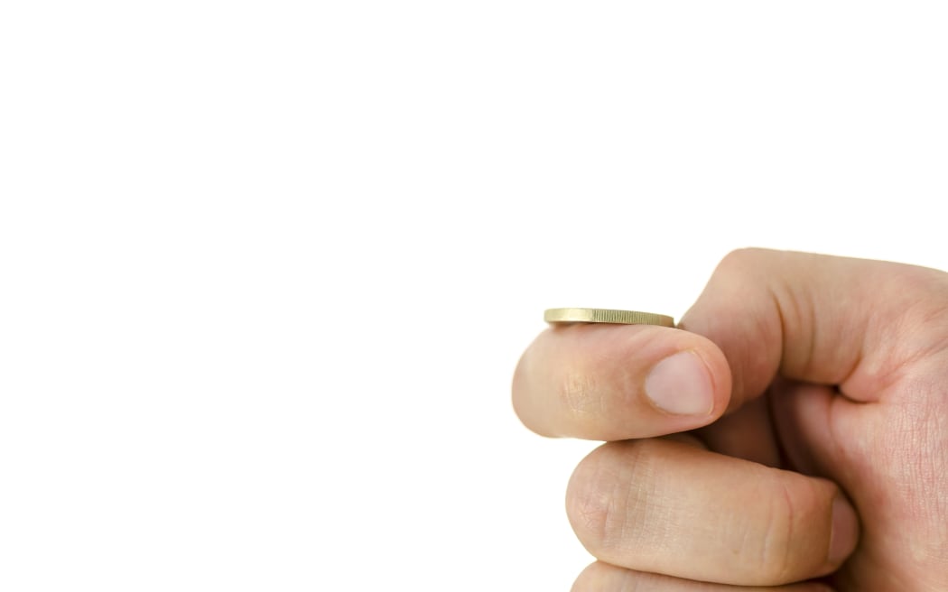 hand holding coin