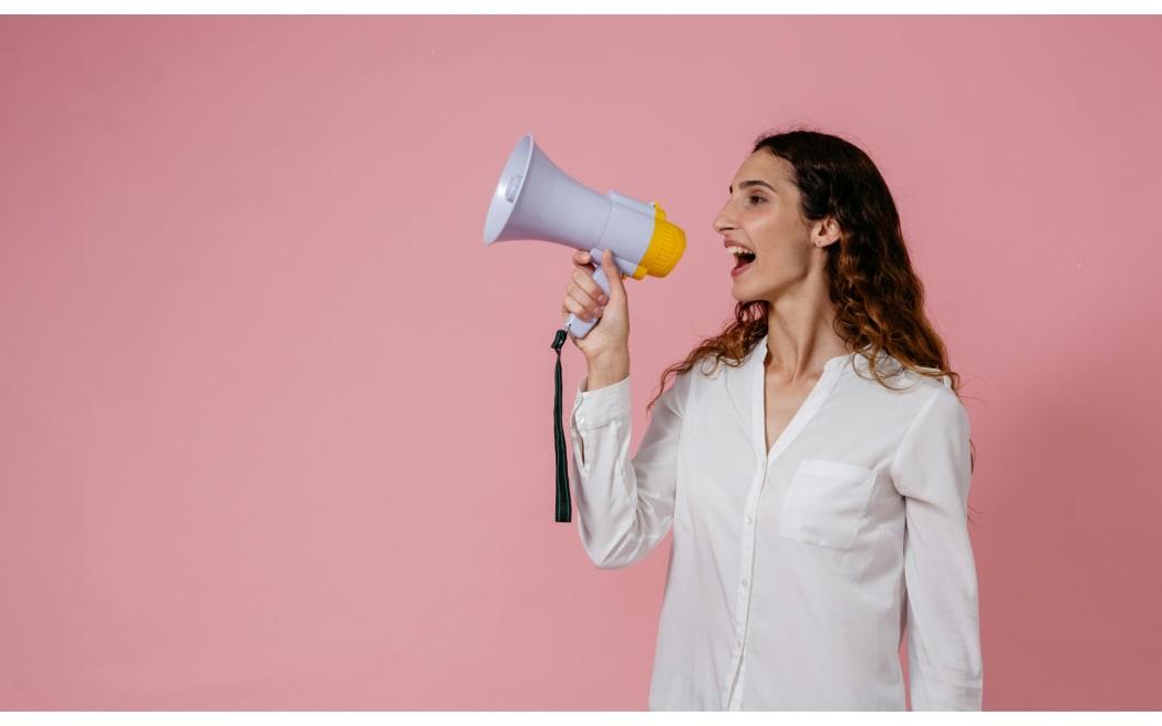 woman speaking through megaphone