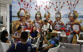 Participants and delegates meet in the Pacific Island pavillon at the Sharm El Sheikh International Convention Centre, on the first day of the COP27 climate summit, in Sharm el-Sheikh.