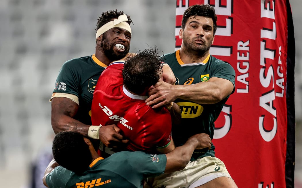 British & Irish Lions' Robbie Henshaw is tackled over the try line by Lukhanyo Am, Siya Kolisi and Damian de Allende of South Africa in the second test in Cape Town 31/7/2021.