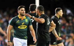 Damian de Allende of South Africa is consoled by Ofa Tu'ungafasi of New Zealand after being sent off during the 2017 Rugby Championship game at Newlands.