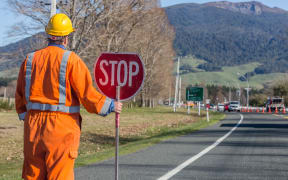 Signs repairs road and worker