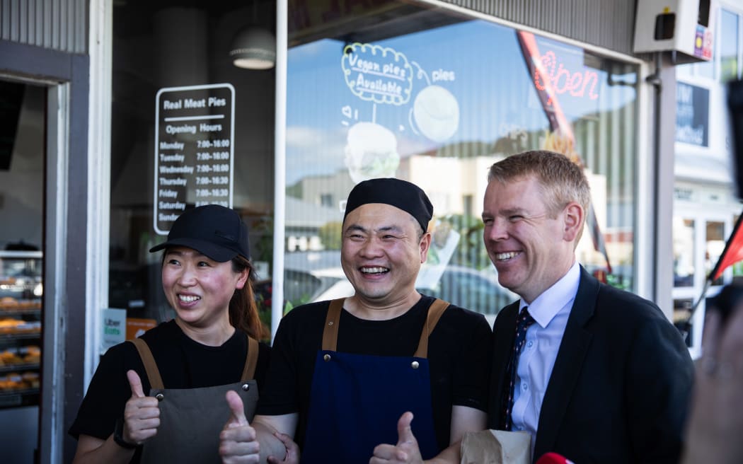 Chris Hipkins visits Real Meat Pies in Lower Hutt, here with owners Jin Tong Li (left) & Jun Jie Zhang.