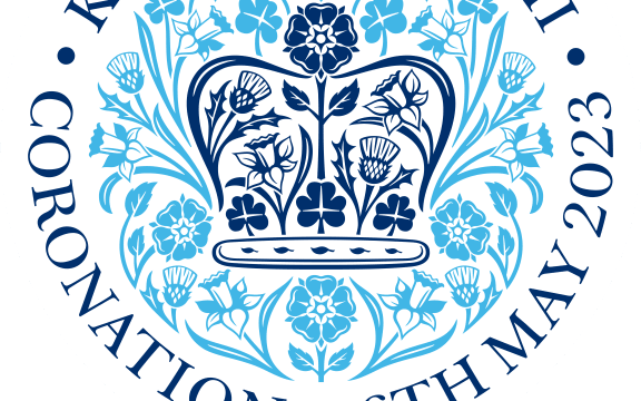 Round logo design with crown and flowers central, words around the outer circle: King Charles III Coronation 6th May 2023.