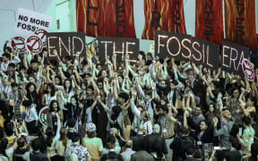 Young activists stage the last protest in COP28 conference venue as the UN Climate Change Conference comes to an end, at the Dubai Exhibition Center, United Arab Emirates on 12 December, 2023.