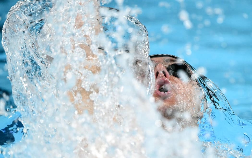 New Zealand's Kane Follows competes in a heat of the men's 200m backstroke swimming event during the Paris 2024 Olympic Games at the Paris La Defense Arena in Nanterre, west of Paris, on July 31, 2024. (Photo by Jonathan NACKSTRAND / AFP)