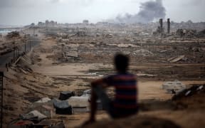 Smoke billows after Israeli bombardment of the Nuseirat refugee camp in northwest Gaza on 9 October.