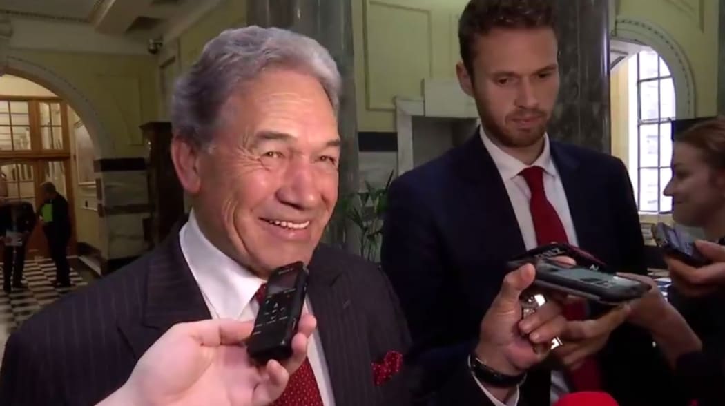 Winston Peters playing 'Radio Gaga' to press gallery reporters from his phone.