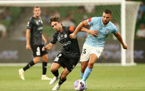 Sam Sutton of Phoenix and Andrew Nabbout of City contest the ball during the A-League Men Round 20 match.