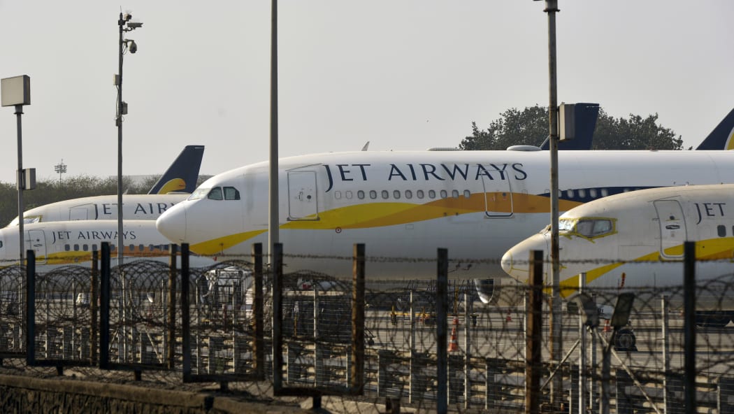 Jet Airways aircraft are seen parked on the tarmac at Chattrapati Shivaji International Airport in Mumbai on March 25, 2019.
