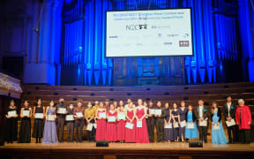 All the finalists at the NZCT Chamber Music Contest 2022 lined up on stage of Auckland Town Hall.