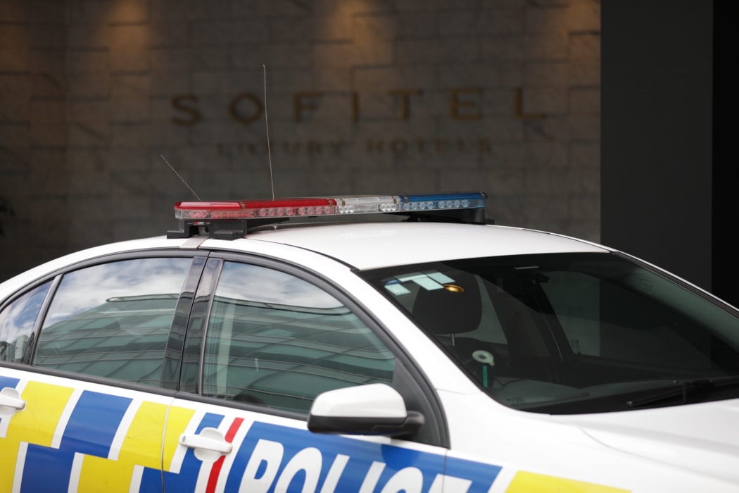 A police car outside the Sofitel in Auckland's Viaduct Harbour.