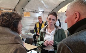 Prime Minister Jacinda Ardern speaks to NZ Defence Force members in Westport