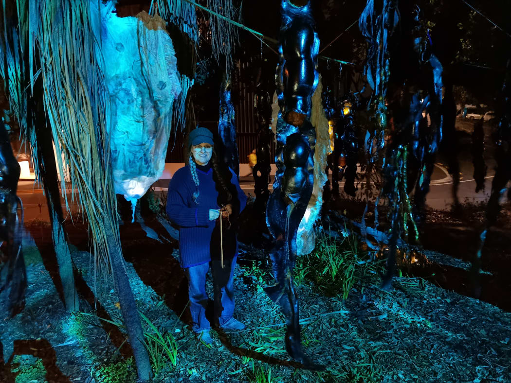 Lynda Duncan with her artwork Rimurapa Light in Motion made from bull kelp, beeswax and plaster casings.