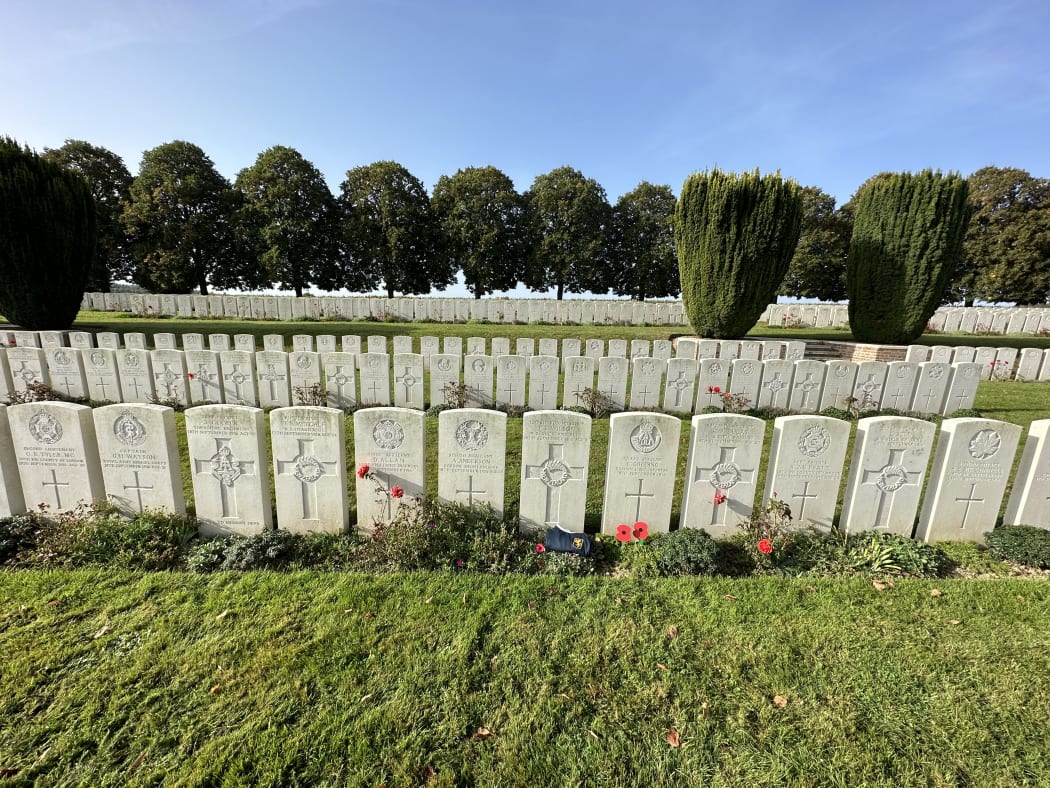Frank Wilson's grave with an Auckland Grammar School First XV jersey, at Dernancourt Communal Cemetery Extension