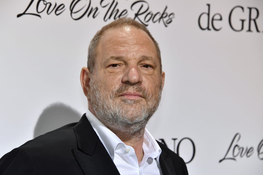 US film producer Harvey Weinstein poses for a photo at Cannes, shortly before news broke of his sexual misconduct.