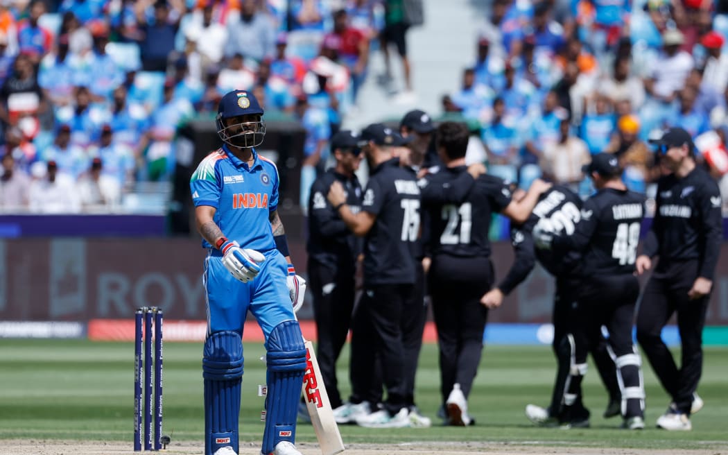Virat Kohli of India is dismissed by New Zealand.