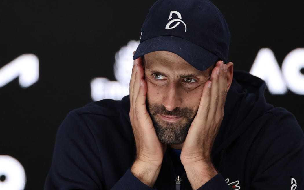Serbia's Novak Djokovic attends a press conference after retiring from his men's singles semi-final match against Germany's Alexander Zverev on day thirteen of the Australian Open tennis tournament in Melbourne on January 24, 2025. (Photo by Adrian Dennis / AFP) / -- IMAGE RESTRICTED TO EDITORIAL USE - STRICTLY NO COMMERCIAL USE --