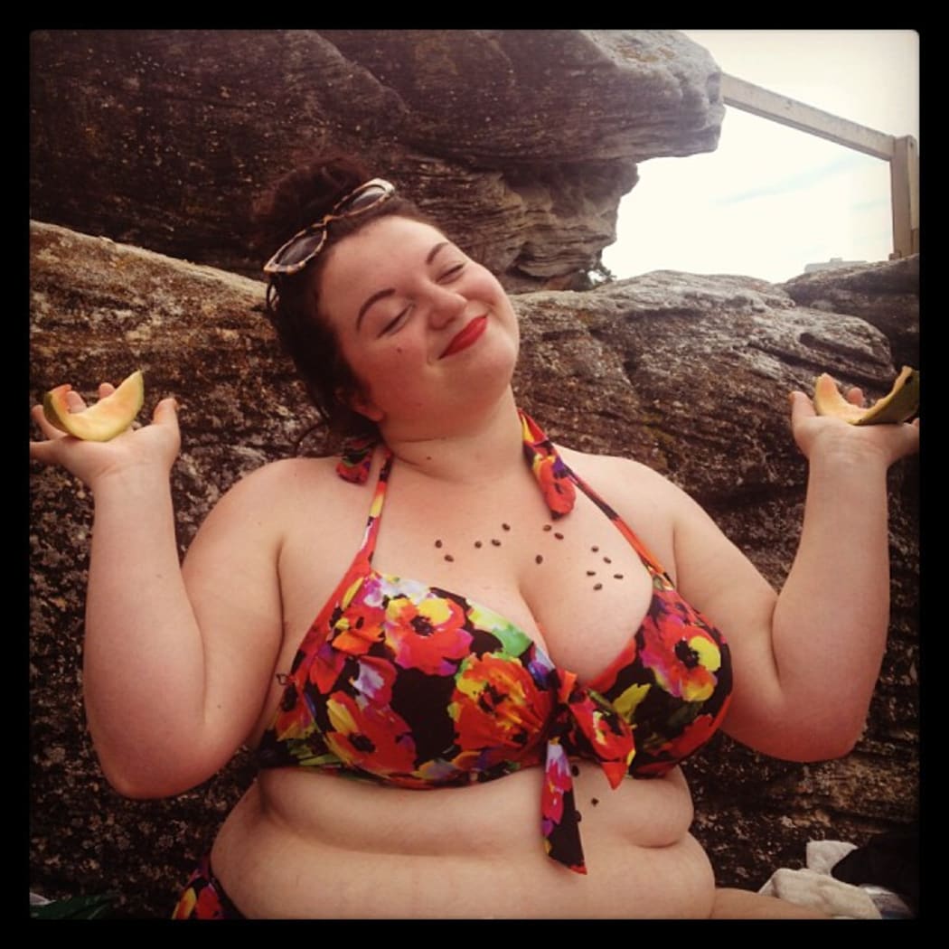Ally wears a watermelon-patterned bikini