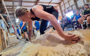 Amy Silcock beat the world record for the women's solo eight-hour ewe shearing, in Pahiatua, with a strong crowd of onlookers.