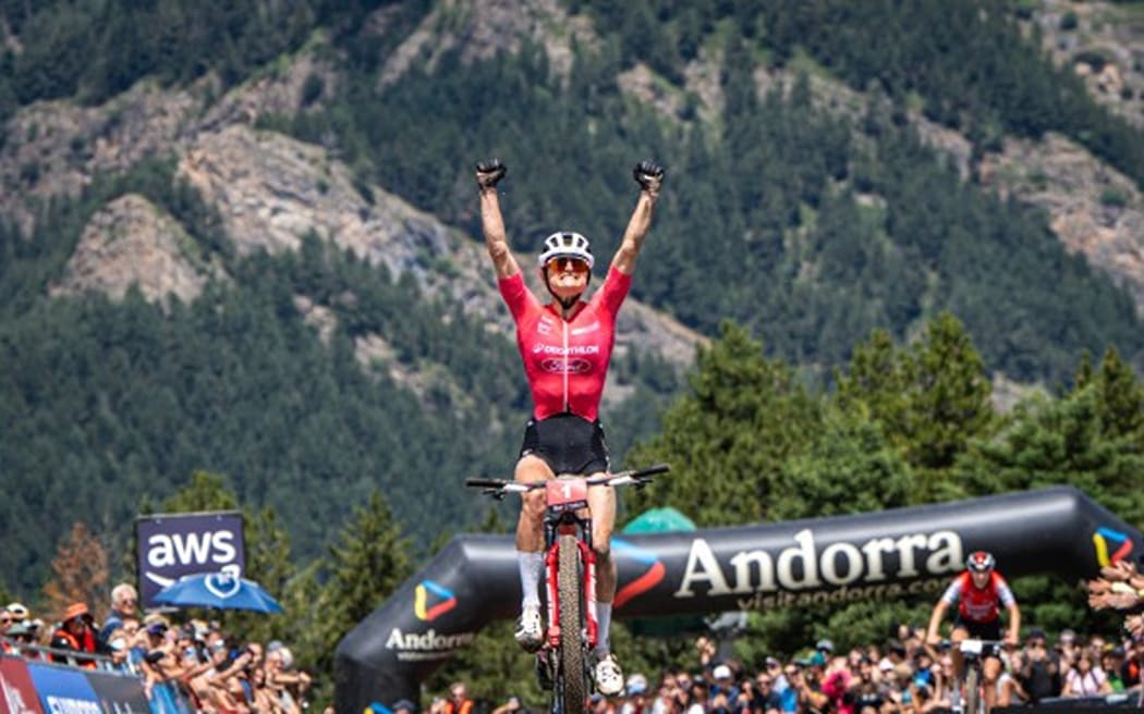 New Zealand mountainbiker Sammie Maxwell celebrates victory in a UCI cross-country event at Pal Arinsal, Andorra, 14 July, 2025.
 (Credit: Decathlon Ford Racing)