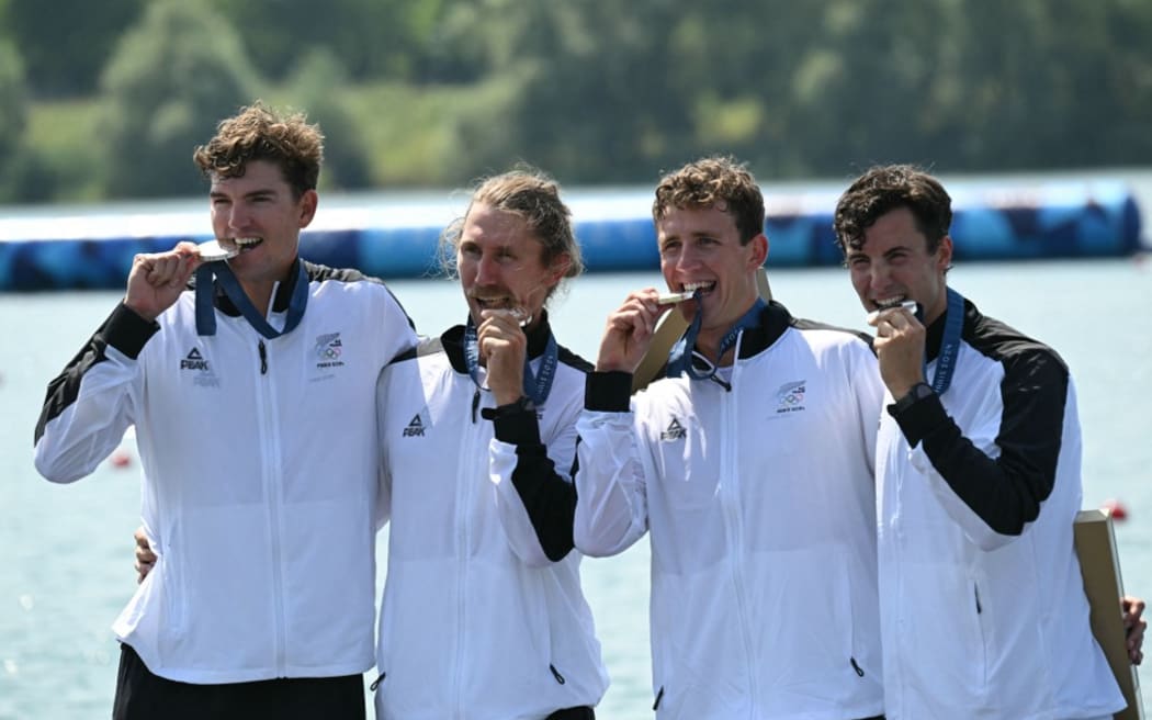 New Zealand's silver medallists Ollie Maclean, Logan Ullrich, Tom Murray and Matt Macdonald pose on the podium during the medal ceremony after the men's four final rowing competition at Vaires-sur-Marne Nautical Centre in Vaires-sur-Marne during the Paris 2024 Olympic Games on August 1, 2024. (Photo by Bertrand GUAY / AFP)