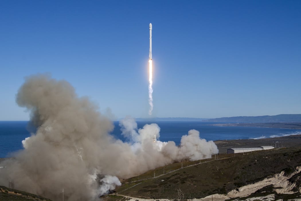 A Falcon 9 rocket lifting off from Vandenberg Air Force Base, California, on January 14, 2017