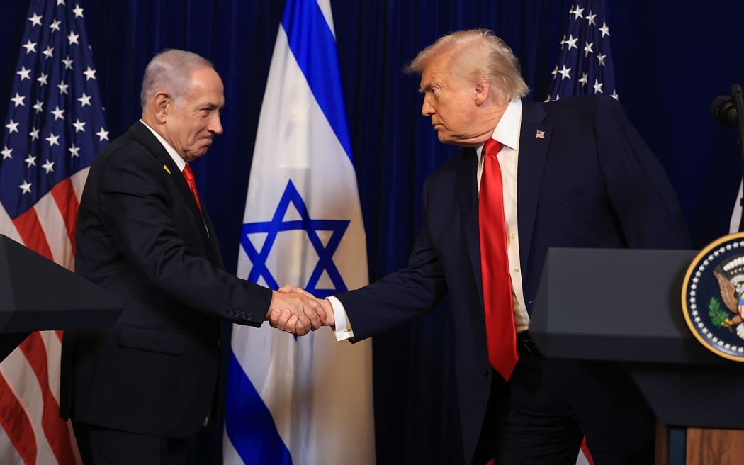 US President Donald Trump shakes hands with Israeli Prime Minister Benjamin Netanyahu during a press conference at his Mar-a-Lago club in Palm Beach, Florida on December 29, 2025.