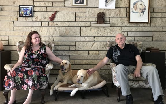 Martine Abel-Williamson and husband Gary with their guide dogs.